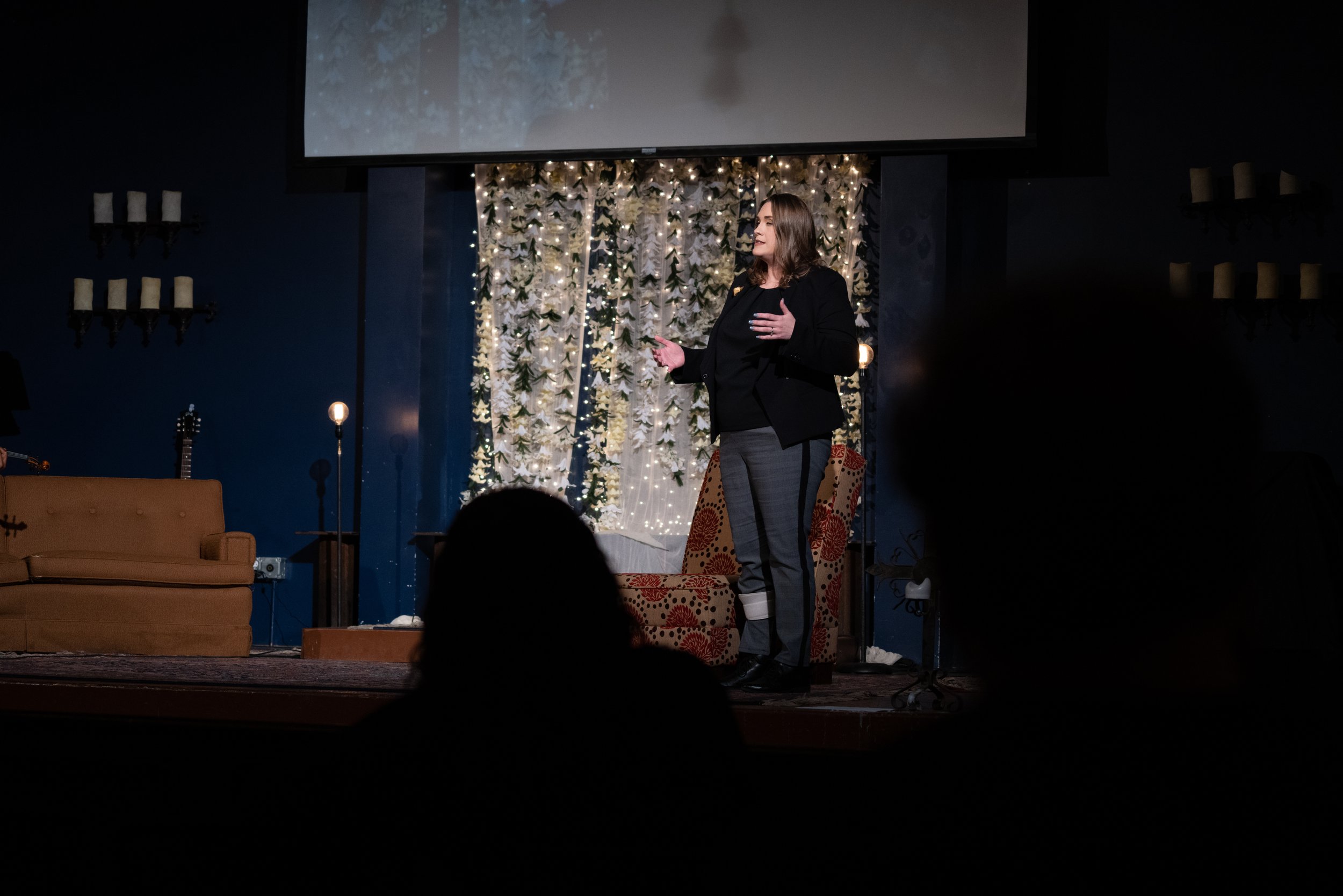 Sharyl speaking to an audience